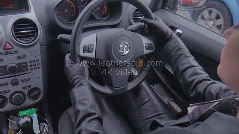 Girl-in-leather-gloves-with-gun-leather-jacket-overknee-leather-boots